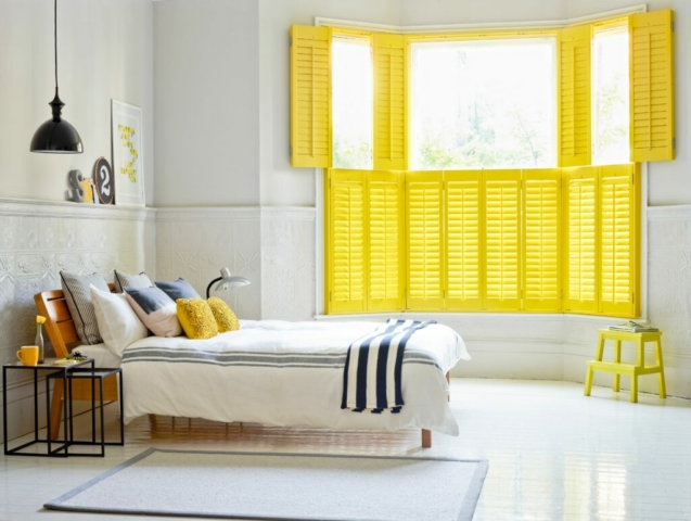 Tier on Tier Yellow Plantation Shutters for the Bed Room