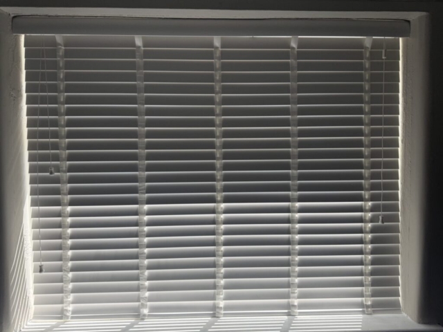 Close-up of Venetian blinds slats for light control horizontal also knows as venetian blinds fitted in Urmston, Greater Manchester
