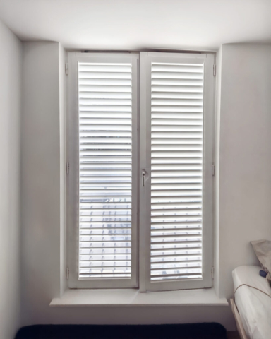 UK Made Perfect Fit PVC Plantation Shutters for Bedroom Balcony Doors and Windows Beautifully fitted UK made white Perfect Fit PVC plantation shutters installed on bedroom balcony doors and windows by Scarlet Blinds in Manchester, custom made for a perfect fit.