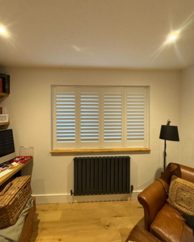 UK Made PVC Plantation Shutters for Home Office Window in Worsley Home office window fitted with UK made white PVC plantation shutters by Scarlet Blinds and Shutters in Worsley, custom made for a perfect fit.