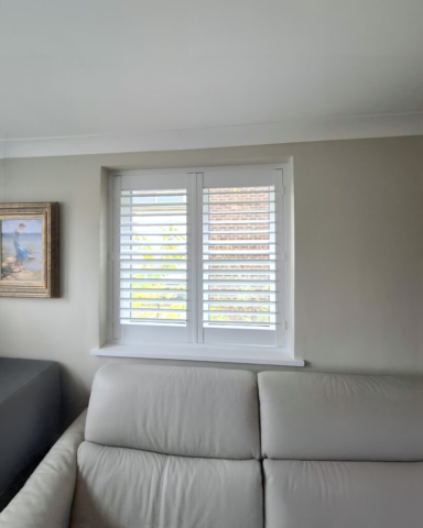 UK Made PVC Plantation Shutters for Small Bedroom Window Beautifully fitted UK made white PVC plantation shutters installed on a small bedroom window by Scarlet Blinds in Manchester, custom made for a perfect fit.