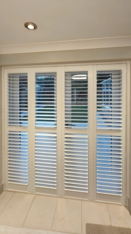 White PVC Plantation Shutters for Patio Doors by Scarlet Blinds and Shutters White PVC plantation shutters fitted to a patio door by Scarlet Blinds and Shutters, providing light control and privacy