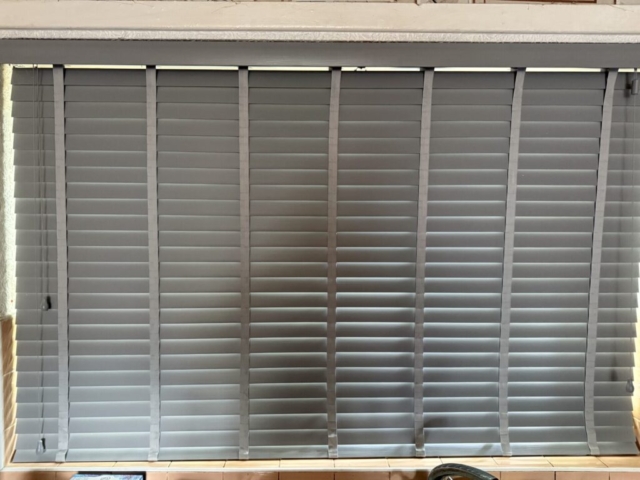 50mm Slats Venetian Blind with Tapes in Longsight Manchester 50mm slat Venetian blind with decorative tapes fitted in a home in Longsight Manchester, offering stylish light control and privacy