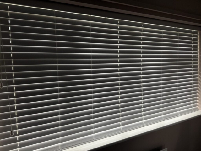 Closed Venetian Blind in Newton Heath Back Bedroom Venetian blind fully closed in a back bedroom in Newton Heath, installed by Scarlet Blinds and Shutters