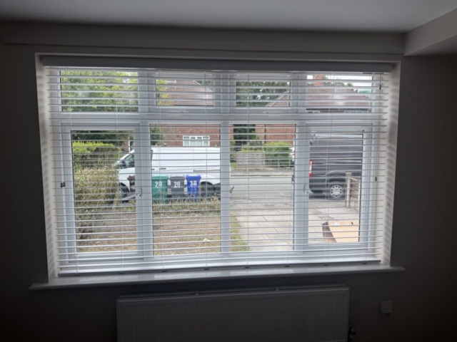 Living Room Venetian Blind Installation in Newton Heath Venetian blind fitted to a living room front window in Newton Heath by Scarlet Blinds and Shutters