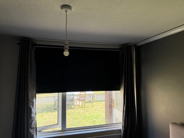 black-blackout-roller-blinds-droylsden-manchester Modern black blackout roller blinds installed in Droylsden Manchester property