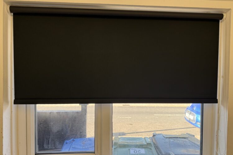 Black roller blackout blinds fitted in Droylsden Manchester for full light control