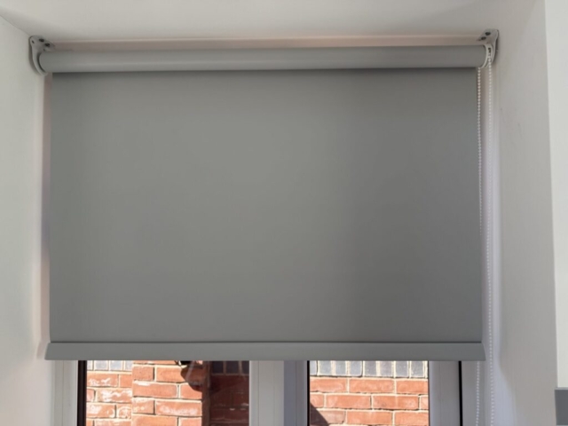 Aqualush Grey Blackout Roller Blind in Blackley, Manchester Aqualush Grey PVC blackout roller blind fitted in a kitchen in Blackley, Manchester