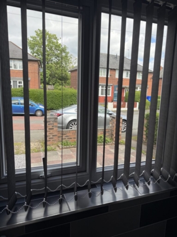 Black Vertical Blind for Kitchen Side Window in Blackley, Manchester Black vertical blind fitted to a kitchen side window in Blackley, Manchester
