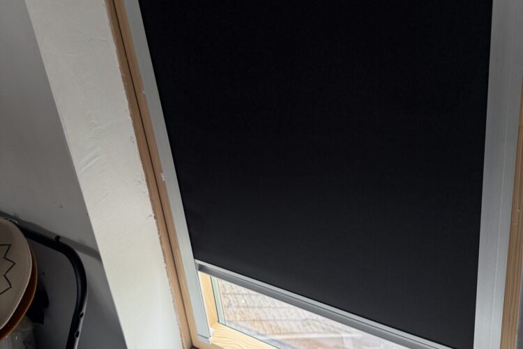 Black OptiLight skylight blind half open fitted by Scarlet Blinds and Shutters in Little Lever, Bolton